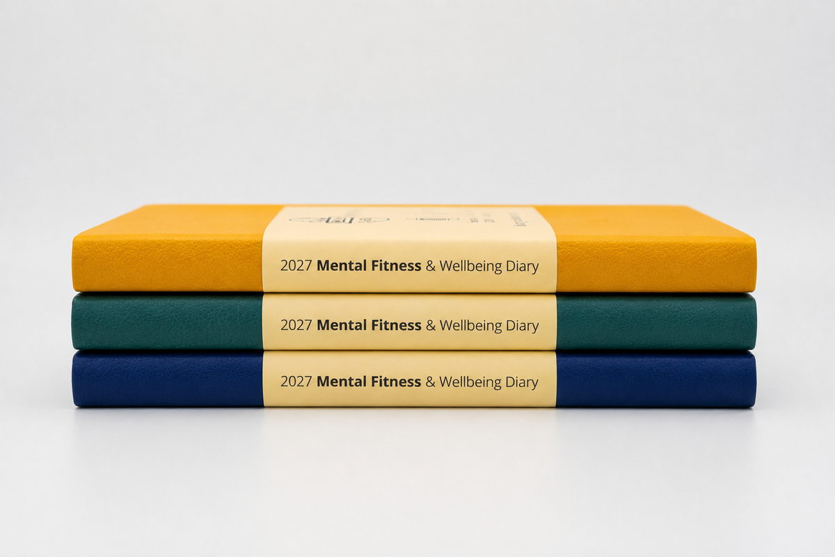 Three colours for the 2027 Mental Fitness Diary. Golden Mustard, Classic Navy, Forest Green. They are stacked on top of each other